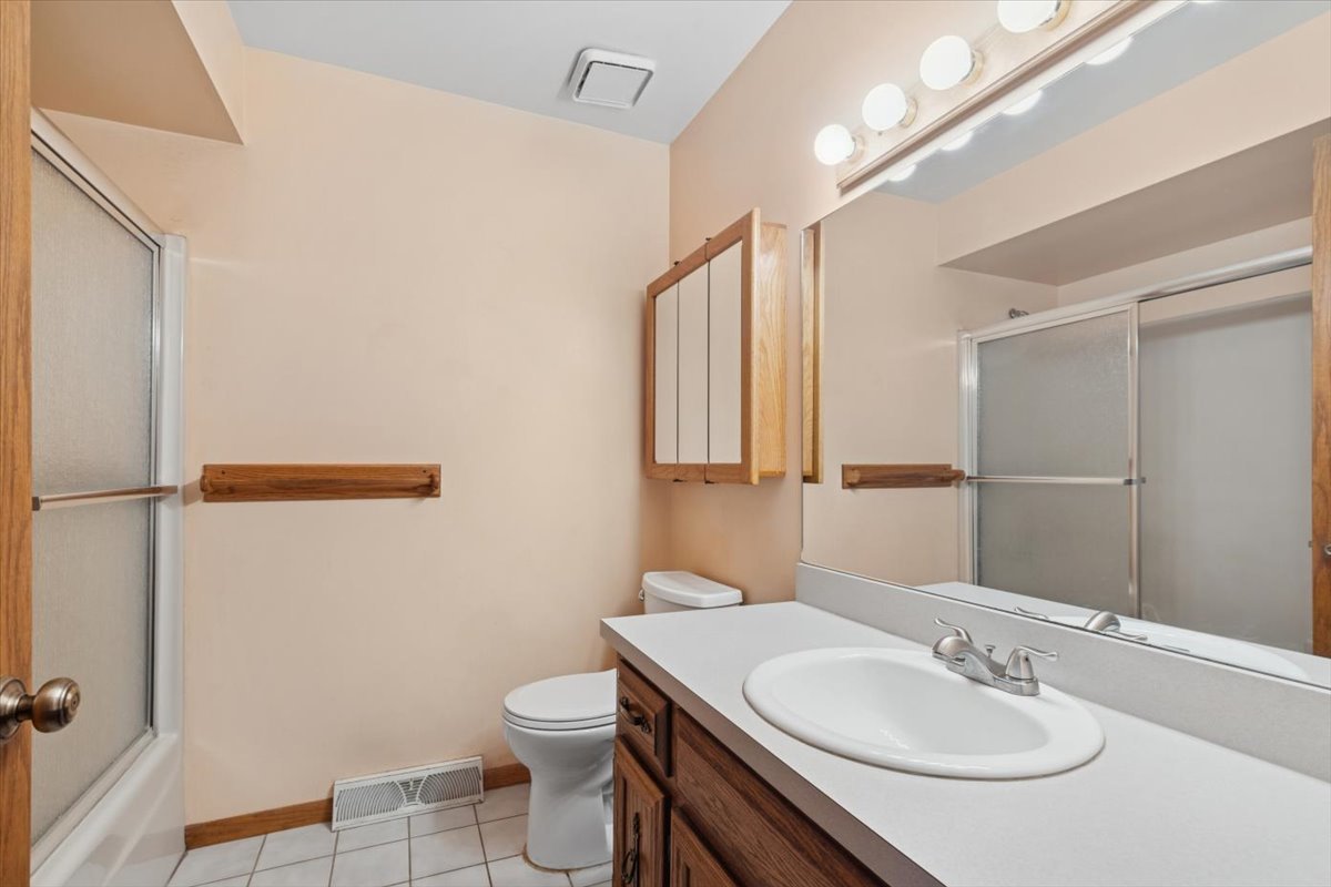 320 South Garfield Avenue New Lenox, IL 60451 - Photo 13 of 20 a bathroom with a sink toilet and shower