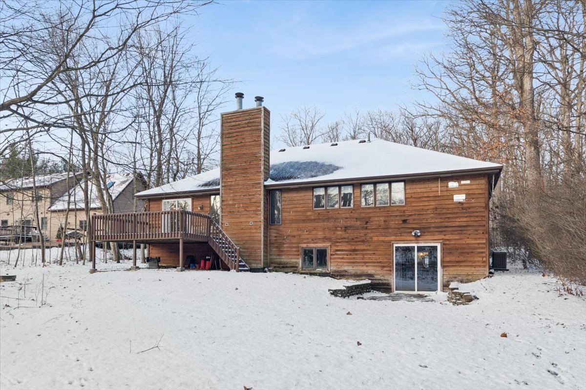 320 South Garfield Avenue New Lenox, IL 60451 - Photo 19 of 20 a front view of a house with a yard covered in snow