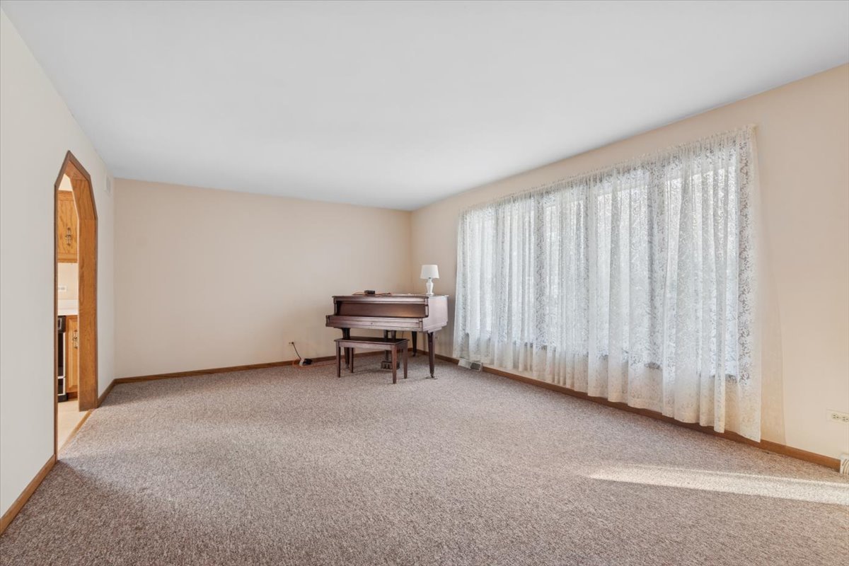 320 South Garfield Avenue New Lenox, IL 60451 - Photo 3 of 20 a view of a room with furniture and a window