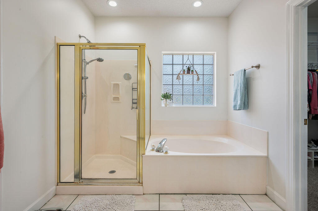 4475 New Market Road Niceville, FL 32578 - Photo 16 of 31 a white bath tub sitting next to a shower