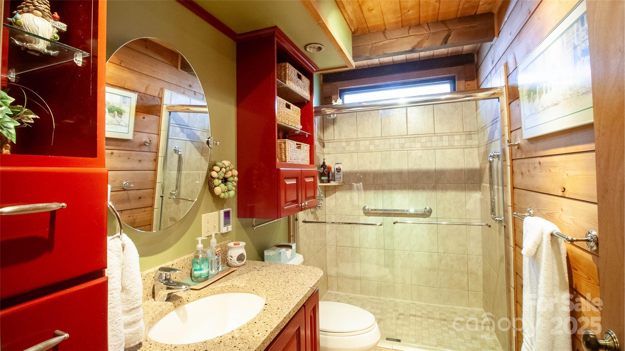 280 Kilgore Road Waynesville, NC 28785 - Photo 16 of 45 a bathroom with a granite countertop shower sink vanity mirror and toilet