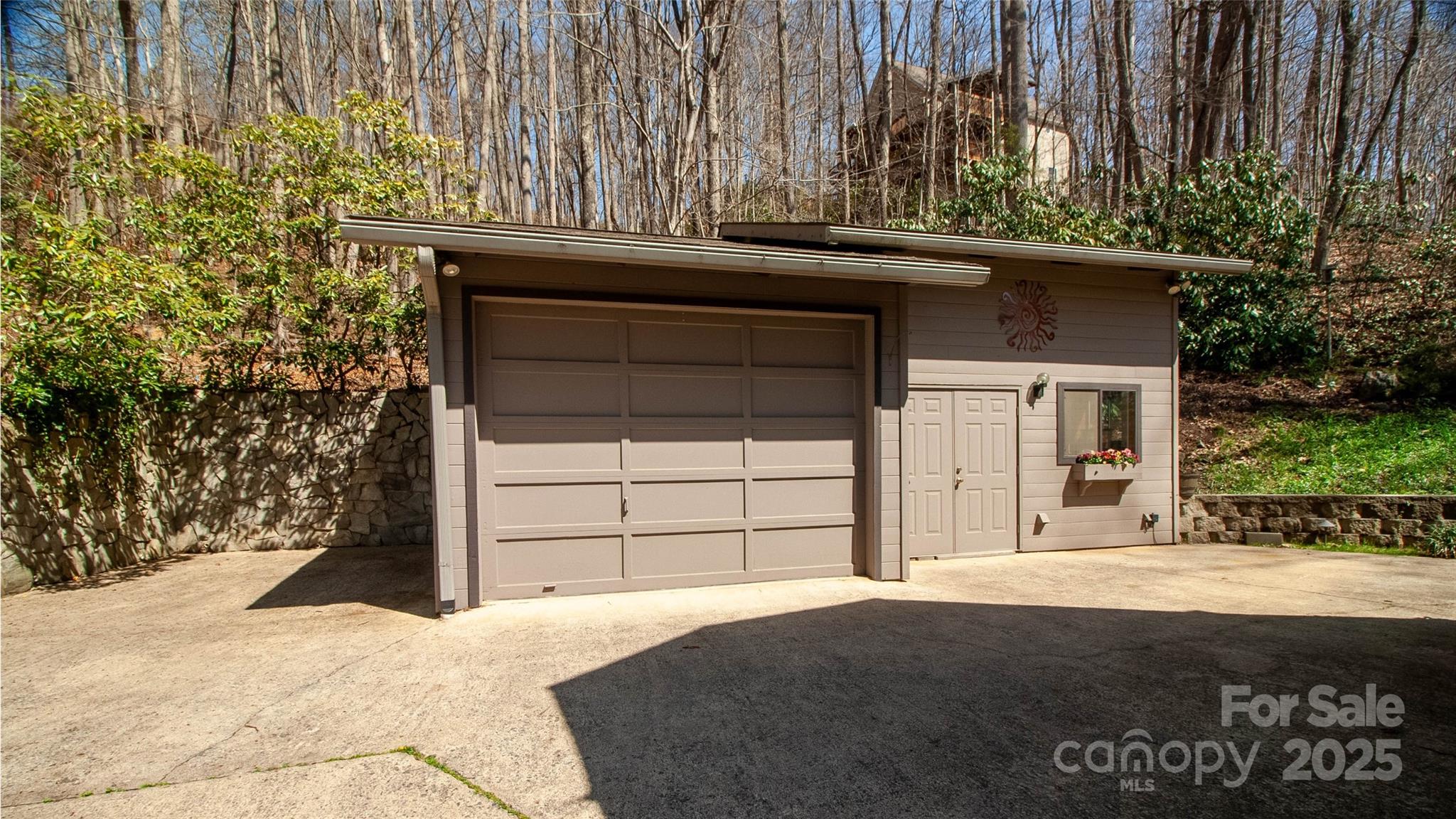 280 Kilgore Road Waynesville, NC 28785 - Photo 20 of 45 a front view of a house with a yard and garage