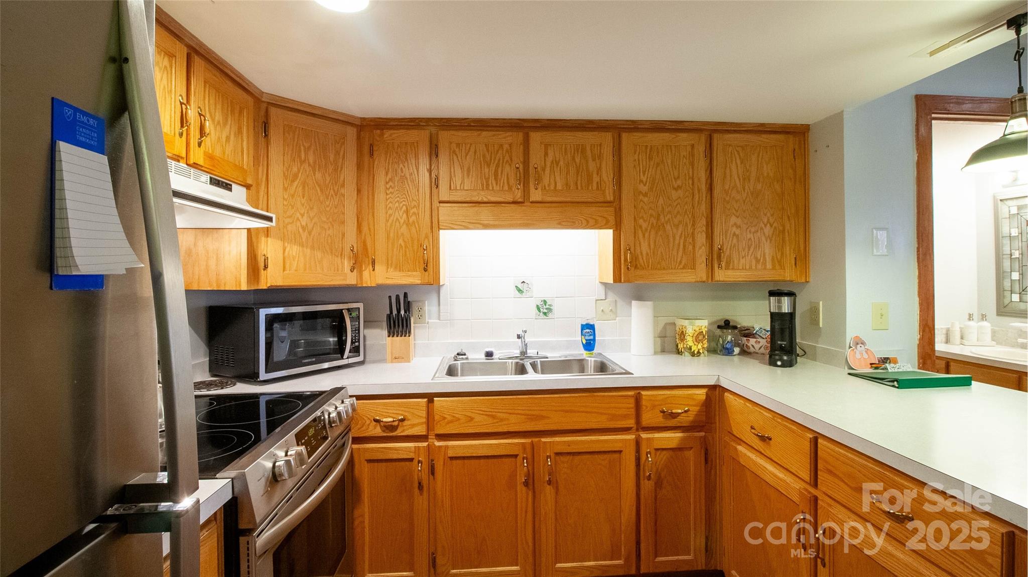 280 Kilgore Road Waynesville, NC 28785 - Photo 28 of 45 a kitchen with a sink a window and cabinets