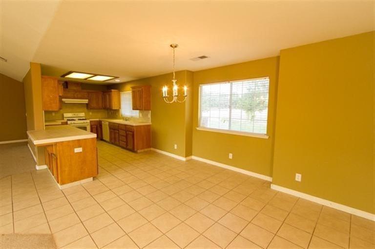 Eating area and breakfast bar convenient to kitchen.