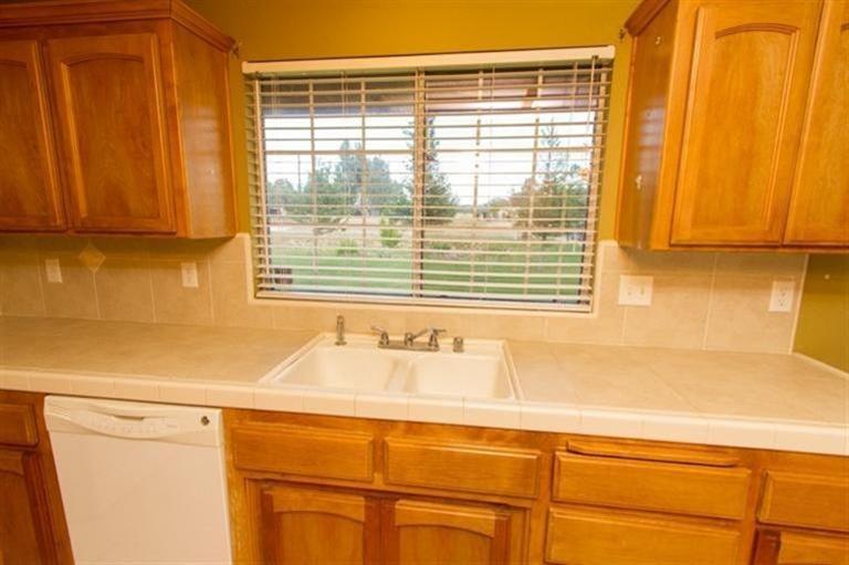 Kitchen window viewing the front set back from street.