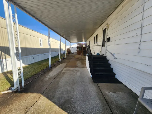 a view of a hallway with stairs