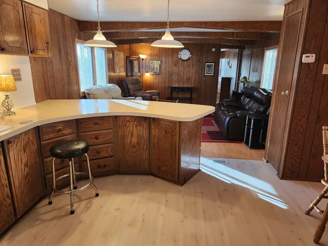 a dining hall with a sink and a mirror