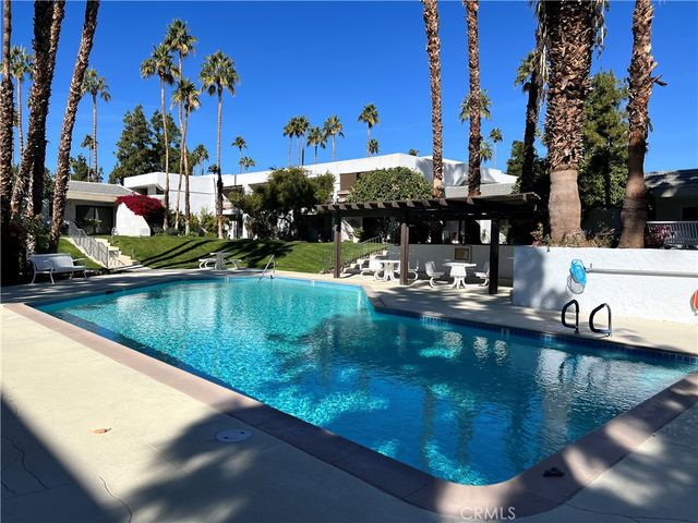 a view of swimming pool with a patio