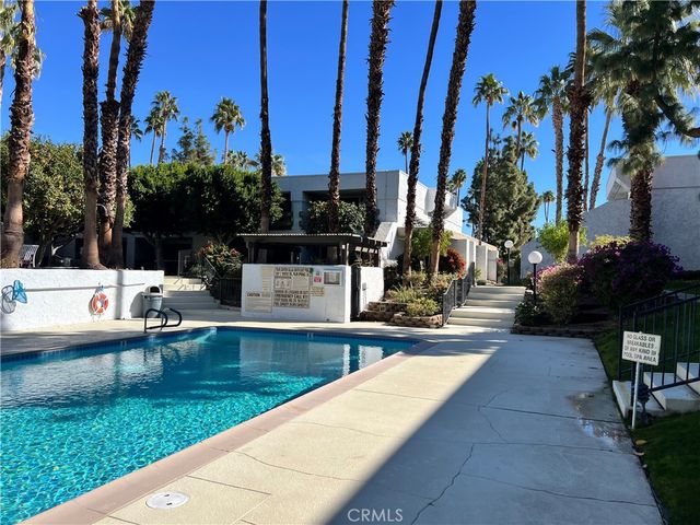 a view of a swimming pool with a garden