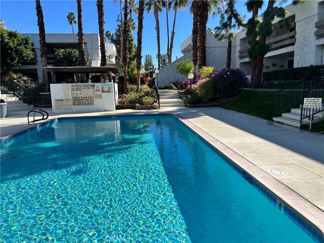a view of a back yard with patio