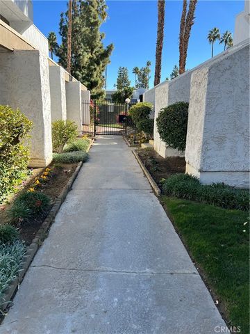 a view of a potted flower in the corridor