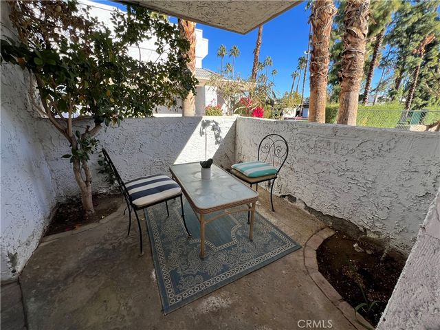 a living room with furniture and flowers