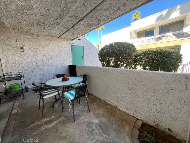 a bedroom with bed and a mirror