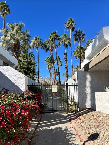 a view of a flower in front of a house