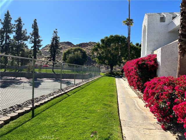 a view of swimming pool with outdoor seating