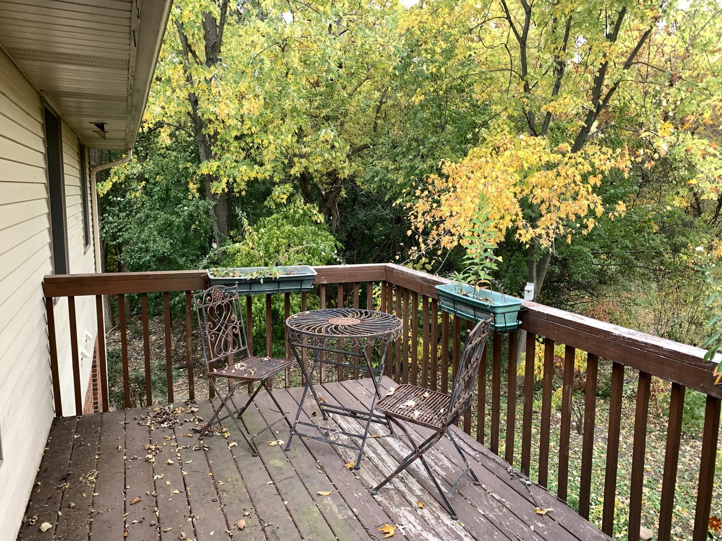 1675 West Beach Road, Unit 1675 Waukegan, IL 60087 - Photo 11 of 12 a view of balcony with wooden floor and outdoor seating