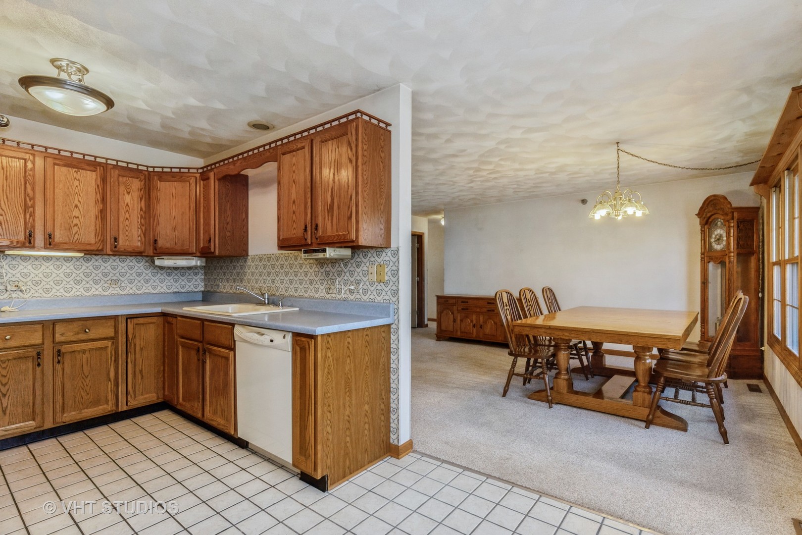 1675 West Beach Road, Unit 1675 Waukegan, IL 60087 - Photo 4 of 12 a kitchen with stainless steel appliances granite countertop a sink and a refrigerator