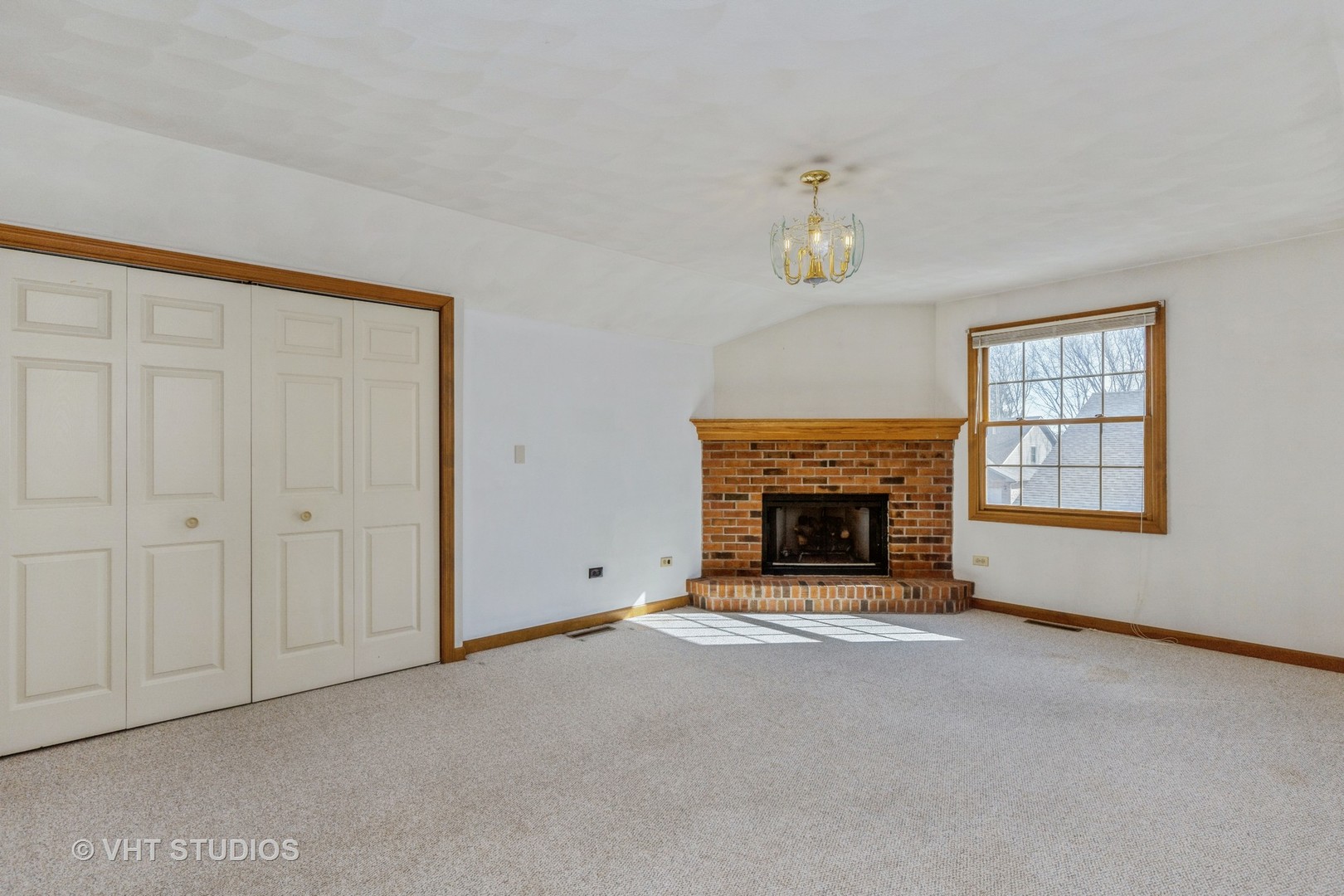 1675 West Beach Road, Unit 1675 Waukegan, IL 60087 - Photo 8 of 12 a view of a livingroom with a fireplace and window