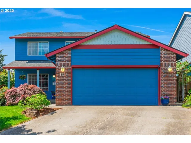 a small yard in front of a house with a small yard