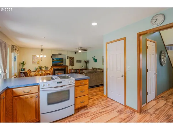 a open kitchen with stainless steel appliances granite countertop a stove and a refrigerator