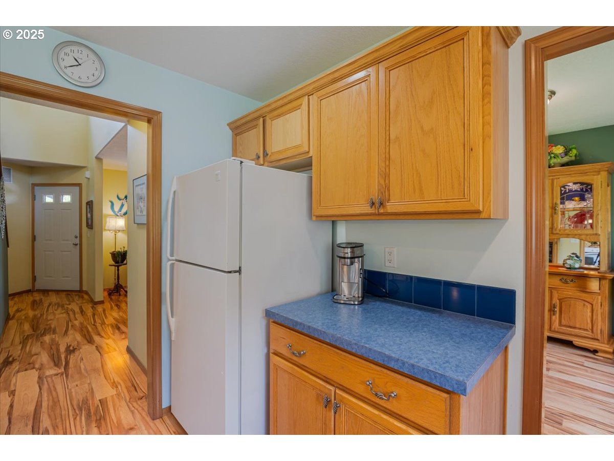 287 Southwest Oliver Court Dundee, OR 97115 - Photo 21 of 41 a kitchen with stainless steel appliances granite countertop a refrigerator and a sink