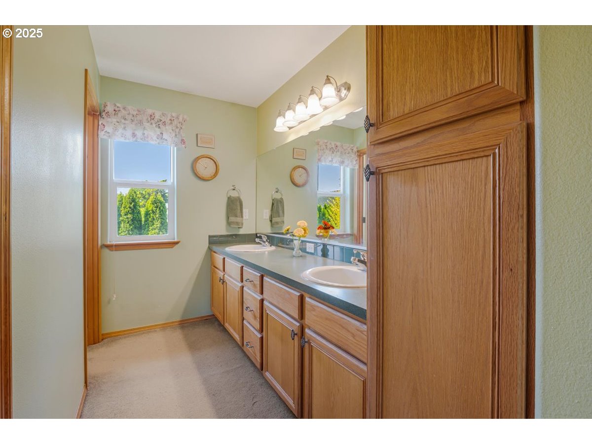 287 Southwest Oliver Court Dundee, OR 97115 - Photo 30 of 41 a bathroom with a sink and a mirror