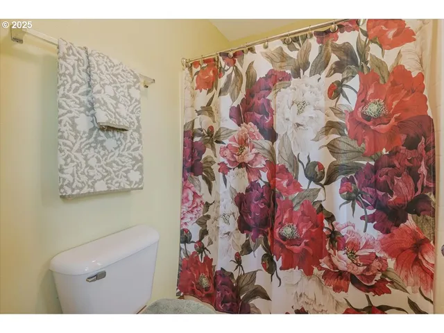 a bathroom with a shower curtain
