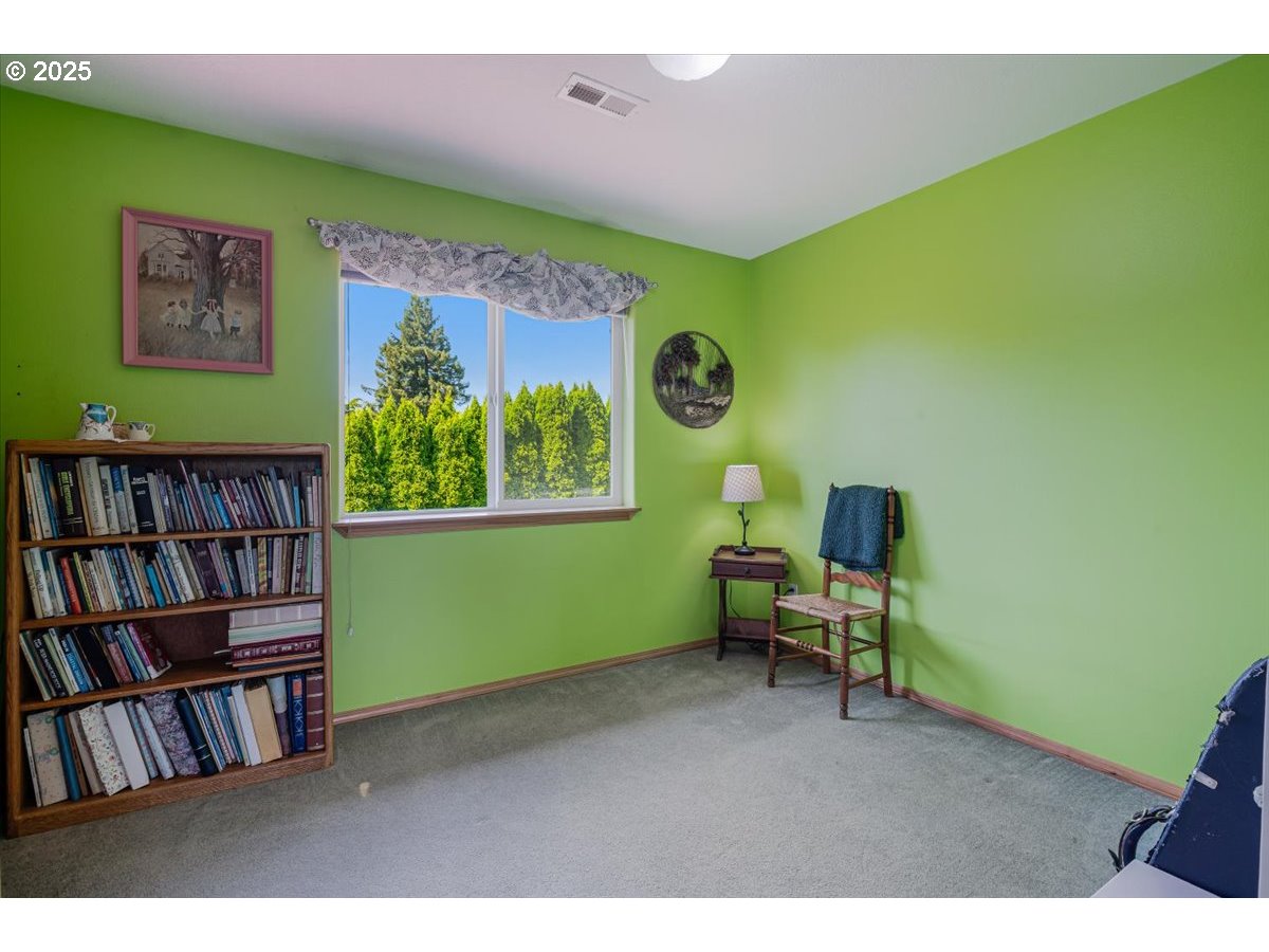 287 Southwest Oliver Court Dundee, OR 97115 - Photo 33 of 41 a living room with furniture and a book shelf