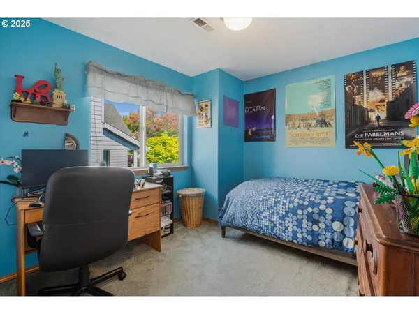 a bedroom with furniture and a window