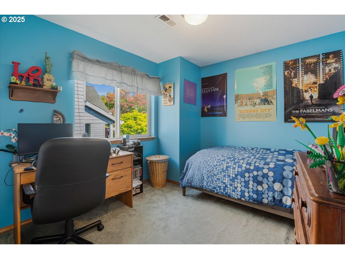 287 Southwest Oliver Court Dundee, OR 97115 - Photo 35 of 41 a bedroom with furniture and a window