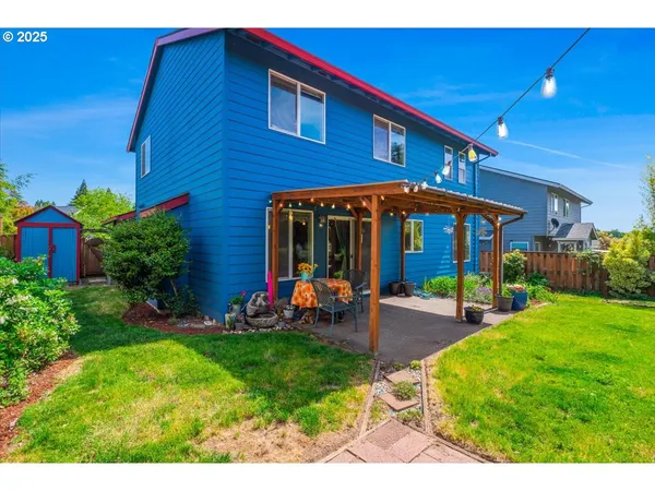 a view of a house with a yard porch and sitting area