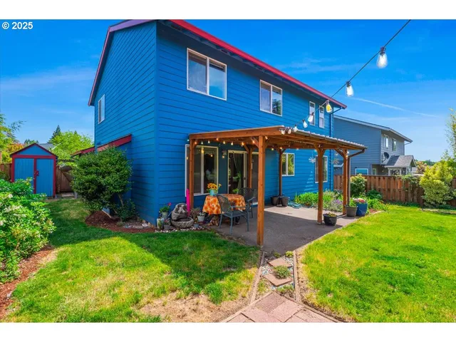 a view of a house with a yard porch and sitting area