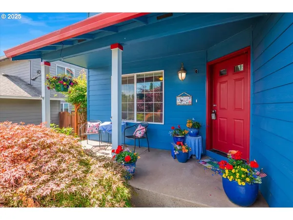 a front view of a house with outdoor seating