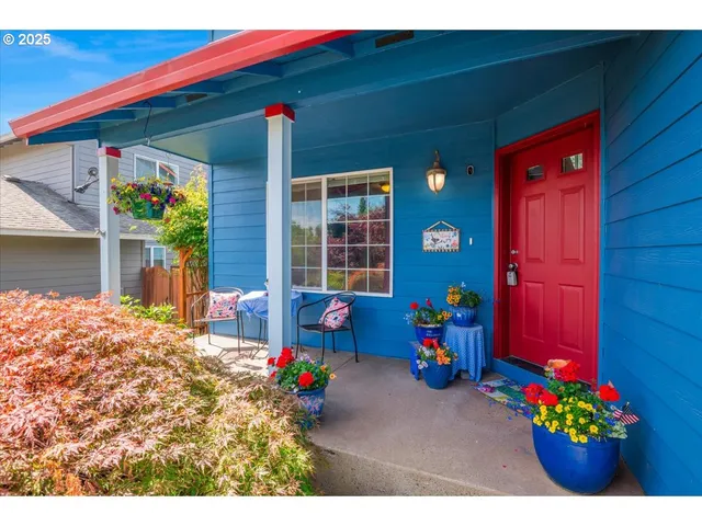 a front view of a house with outdoor seating