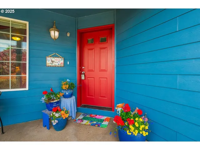 a view of front door of the house with wooden floor