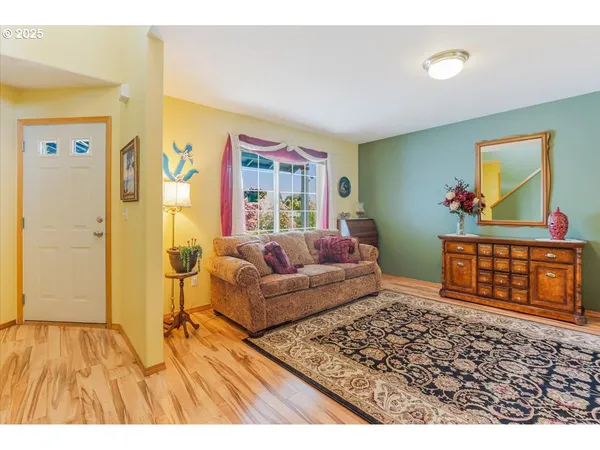 a living room with furniture and a rug