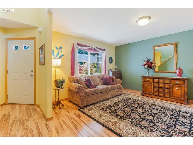 a living room with furniture and a rug