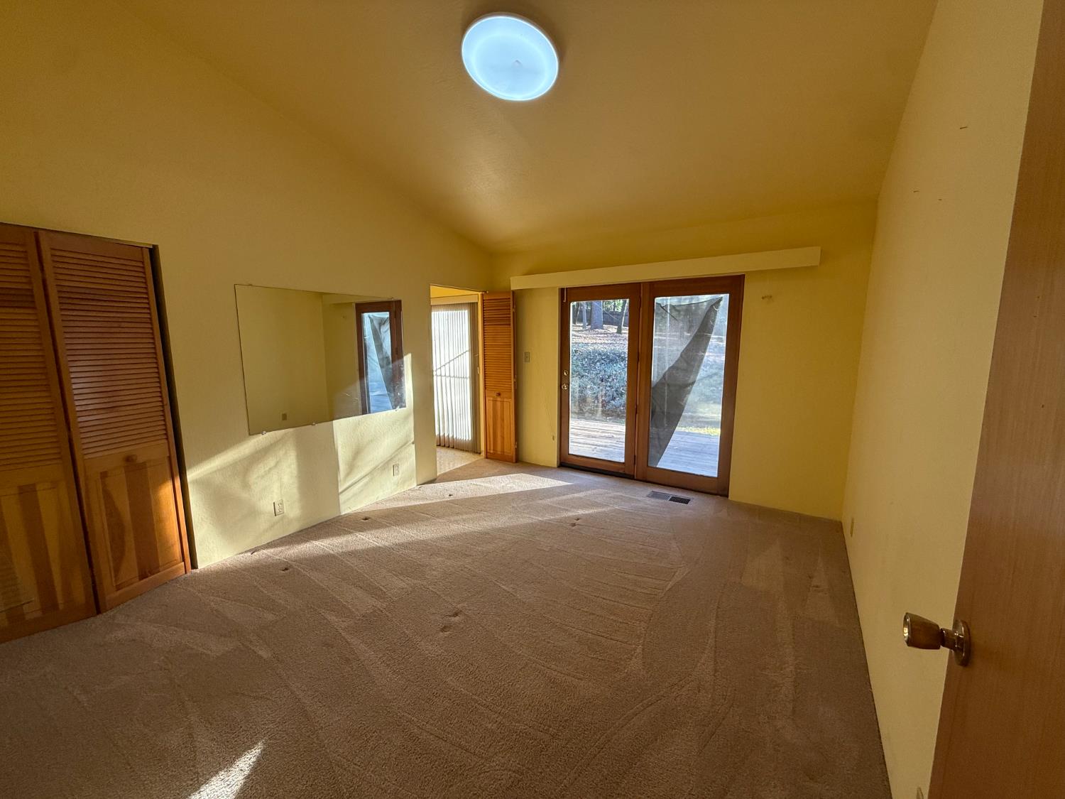 75 Sandy Gulch Lane West Point, CA 95255 - Photo 16 of 39 a view of an empty room with a fireplace and a window