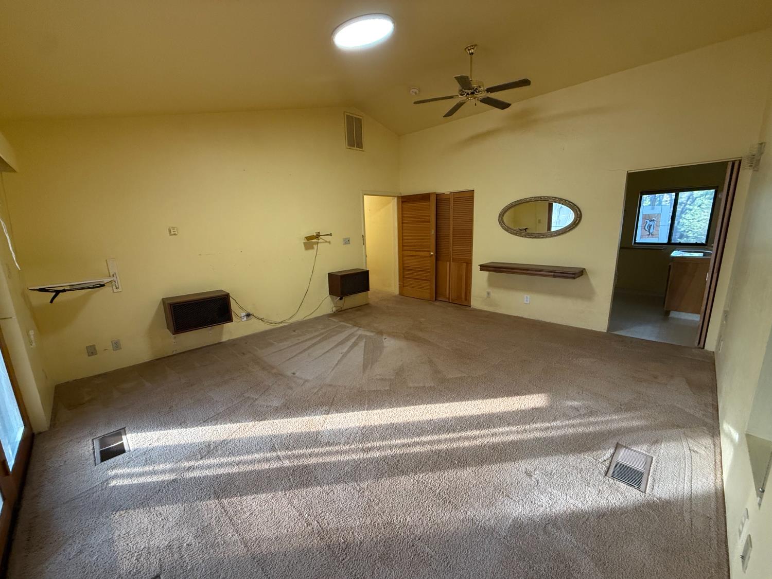 75 Sandy Gulch Lane West Point, CA 95255 - Photo 23 of 39 a view of a livingroom with a refrigerator and a ceiling fan