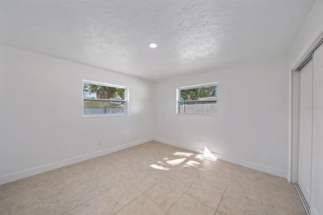 a view of empty room with windows