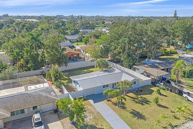an aerial view of a house with swimming pool