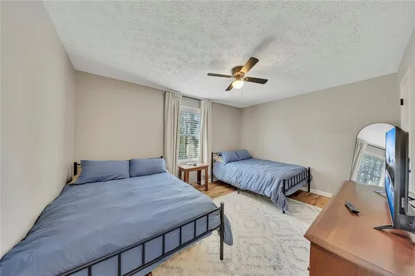 a bedroom with furniture and a window