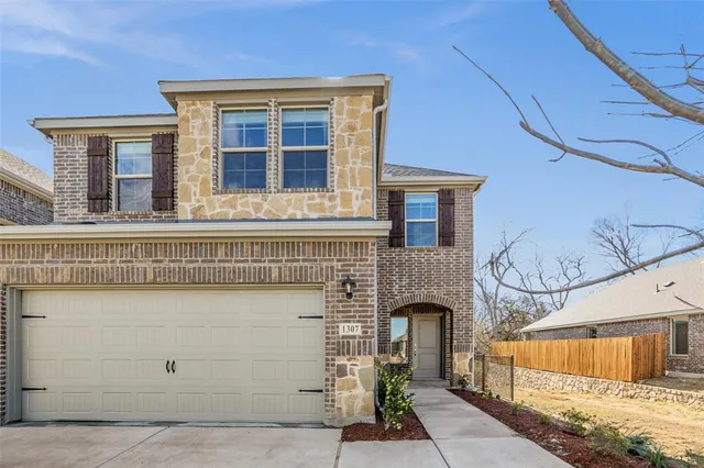 a front view of a house with a garage