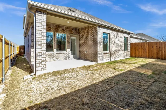 a kitchen with stainless steel appliances a refrigerator sink and microwave