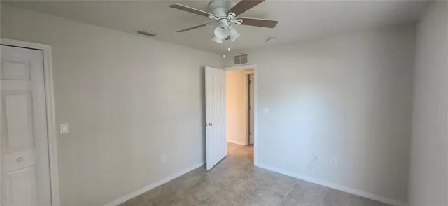 a view of a chandelier fan in a room