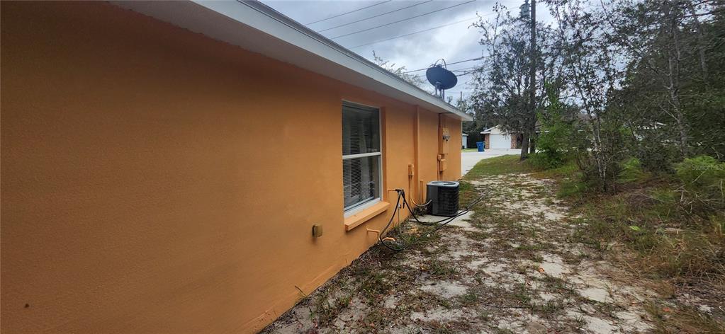 7411 Canterbury Street Spring Hill, FL 34606 - Photo 25 of 28 a view of a back yard of the house