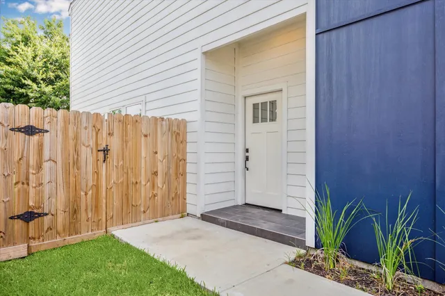 a view of a backyard with potted plants