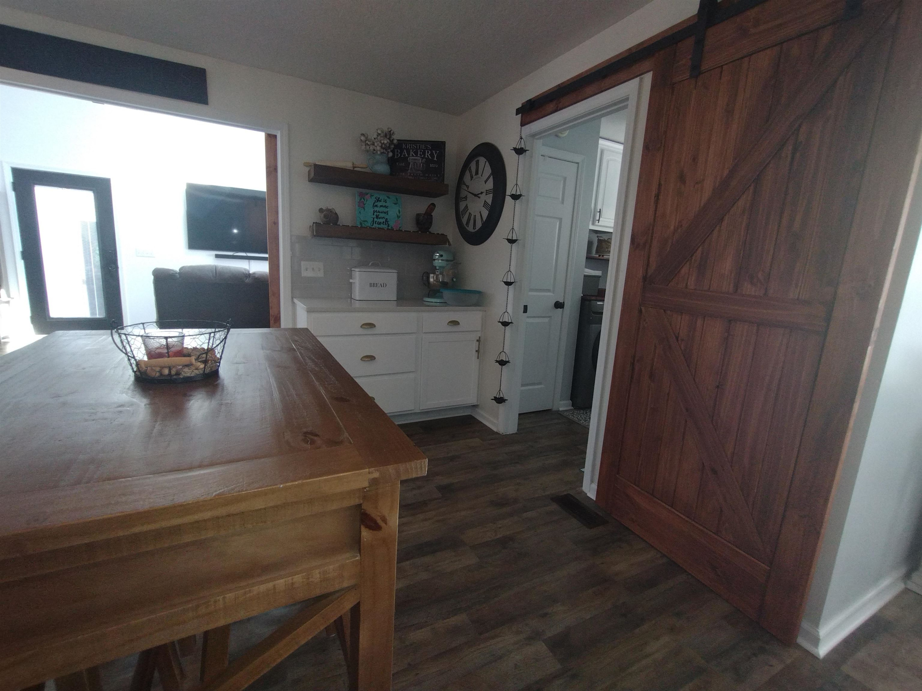 360 Parham Road Martin, TN 38237 - Photo 17 of 32 a view of kitchen cabinetry and wooden floor