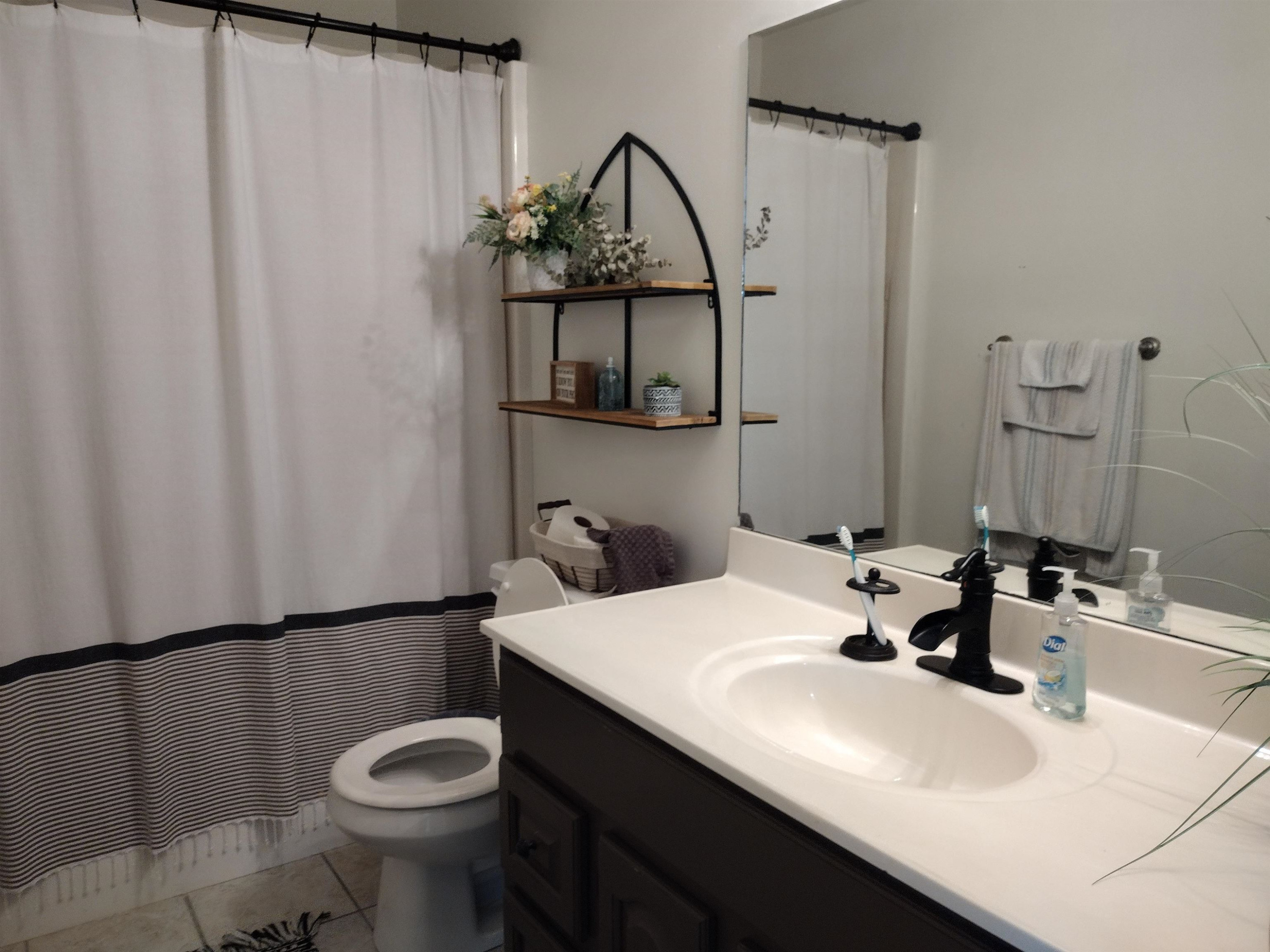 360 Parham Road Martin, TN 38237 - Photo 28 of 32 a bathroom with a sink and a mirror