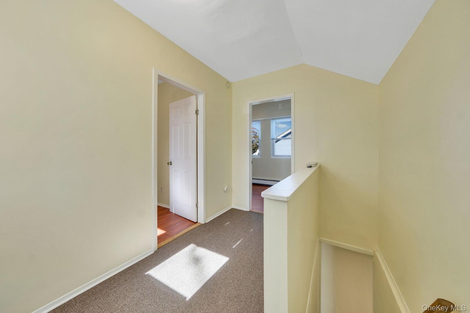 39 Chapman Place, Unit 2 Bay Shore, NY 11706 - Photo 11 of 17 a view of hallway with washer and dryer